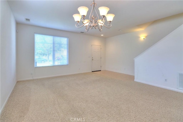 2062 Dunbar Way, Dinuba, CA 93618 - spare room with a chandelier and light carpet
