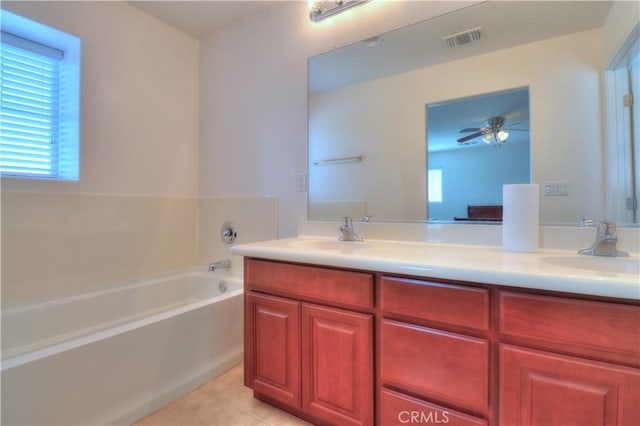 2062 Dunbar Way, Dinuba, CA 93618 - full bath featuring double vanity, a bath, tile patterned floors, and ceiling fan