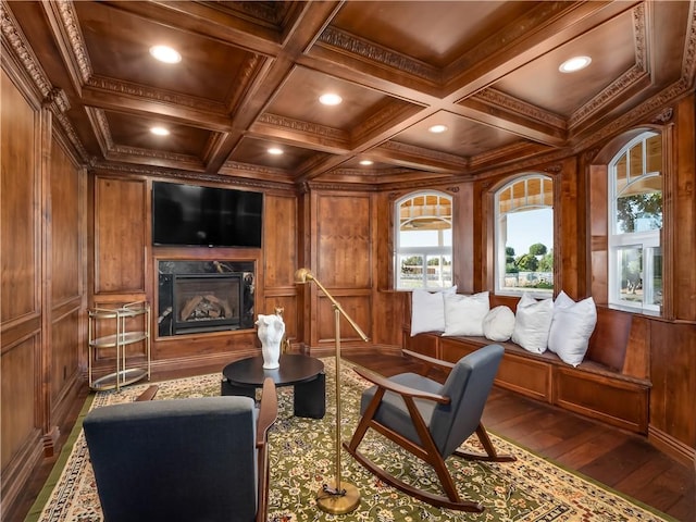 6550 N Blackhawk Ln, Clovis, CA 93619 - sitting room with dark wood finished floors, coffered ceiling, wooden walls, a high end fireplace, and crown molding
