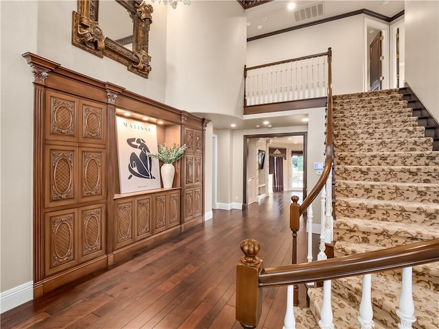 6550 N Blackhawk Ln, Clovis, CA 93619 - entrance foyer featuring dark wood-type flooring, stairway, and ornamental molding