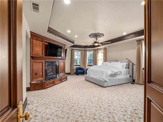 6550 N Blackhawk Ln, Clovis, CA 93619 - bedroom with recessed lighting, carpet flooring, a glass covered fireplace, and crown molding