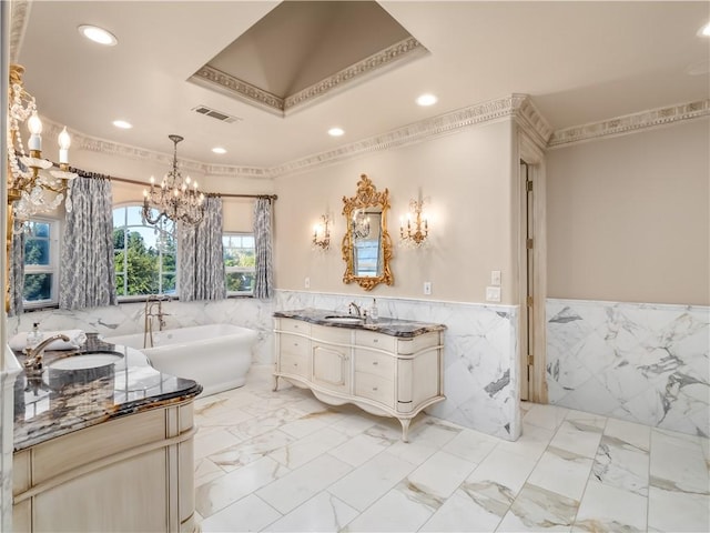 6550 N Blackhawk Ln, Clovis, CA 93619 - full bath featuring tile walls, vanity, a chandelier, a freestanding tub, and recessed lighting