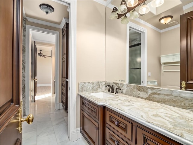 6550 N Blackhawk Ln, Clovis, CA 93619 - bathroom featuring marble finish flooring, vanity, and crown molding
