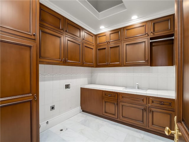 6550 N Blackhawk Ln, Clovis, CA 93619 - laundry room with cabinet space, hookup for an electric dryer, hookup for a washing machine, light marble finish floors, and recessed lighting