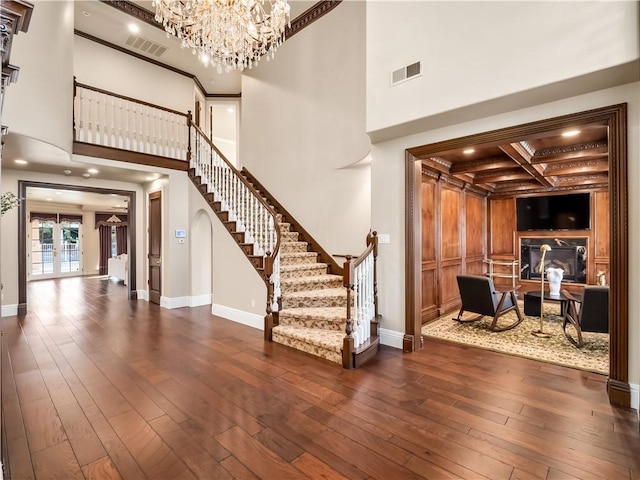 6550 N Blackhawk Ln, Clovis, CA 93619 - foyer with stairs, coffered ceiling, hardwood / wood-style floors, a towering ceiling, and a chandelier