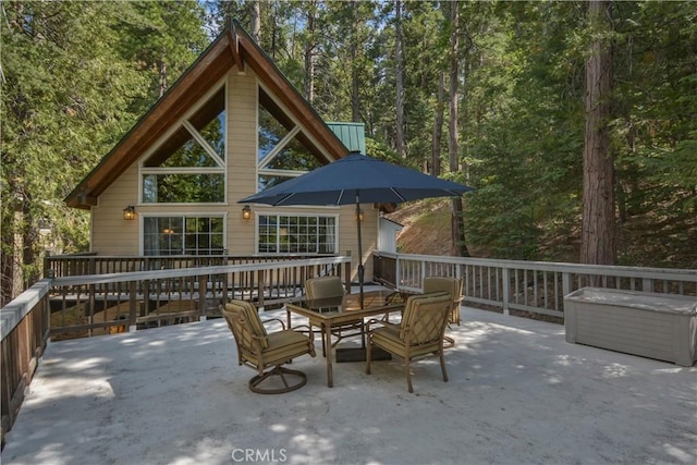26873 Huron Rd, Lake Arrowhead, CA 92317 - view of patio featuring a wooden deck, a wooded view, and outdoor dining area