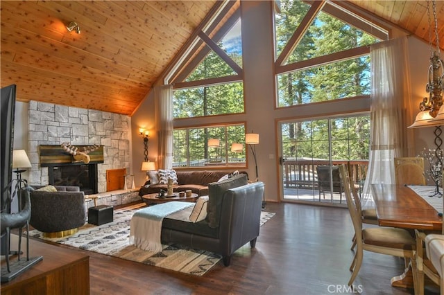 26873 Huron Rd, Lake Arrowhead, CA 92317 - living room featuring high vaulted ceiling, wood ceiling, wood finished floors, and a stone fireplace