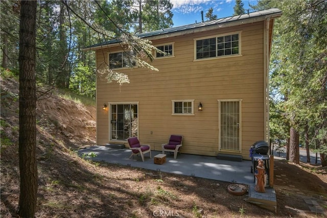 26873 Huron Rd, Lake Arrowhead, CA 92317 - back of property featuring a patio area