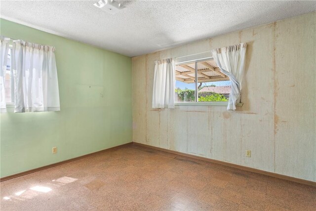 1341 E Monroe, Orange, CA 92867 - spare room featuring tile patterned floors and a textured ceiling