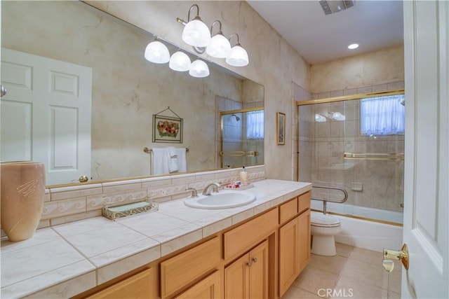 665 Silver Charm Dr, Arroyo Grande, CA 93420 - full bathroom featuring vanity, tile patterned flooring, and combined bath / shower with glass door