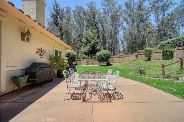 665 Silver Charm Dr, Arroyo Grande, CA 93420 - fenced backyard with area for grilling, outdoor dining space, and a patio