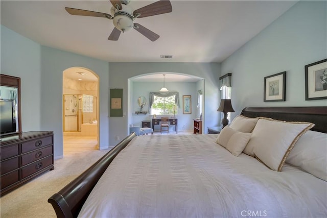 665 Silver Charm Dr, Arroyo Grande, CA 93420 - carpeted bedroom featuring arched walkways, ensuite bathroom, and a ceiling fan