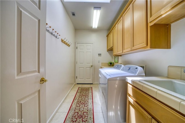 665 Silver Charm Dr, Arroyo Grande, CA 93420 - laundry room featuring cabinet space, washing machine and clothes dryer, and light tile patterned floors