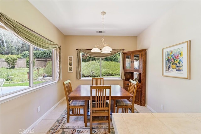 665 Silver Charm Dr, Arroyo Grande, CA 93420 - dining area featuring a chandelier, healthy amount of natural light, and light tile patterned flooring