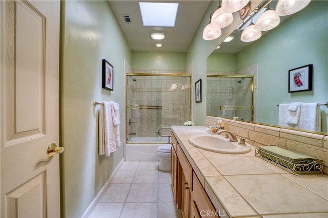 665 Silver Charm Dr, Arroyo Grande, CA 93420 - full bathroom featuring vanity, tile patterned flooring, and bath / shower combo with glass door
