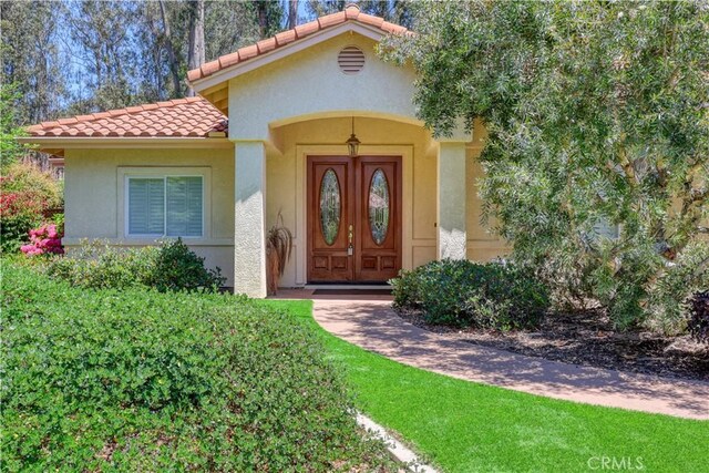 665 Silver Charm Dr, Arroyo Grande, CA 93420 - property entrance featuring stucco siding and a tiled roof