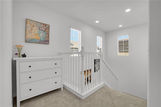 8595 Founders Grove St, Chino, CA 91708 - hallway with an upstairs landing, light carpet, healthy amount of natural light, and recessed lighting