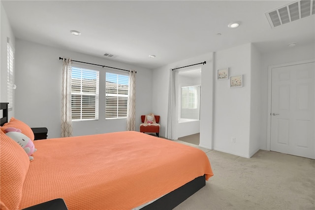 8595 Founders Grove St, Chino, CA 91708 - bedroom with light colored carpet, recessed lighting, and ensuite bath