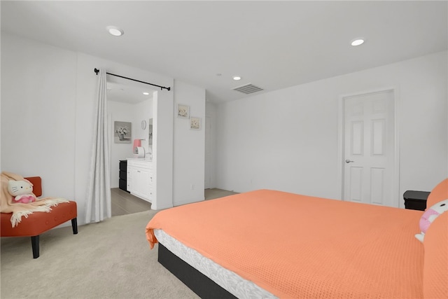 8595 Founders Grove St, Chino, CA 91708 - bedroom with recessed lighting, light colored carpet, and ensuite bath