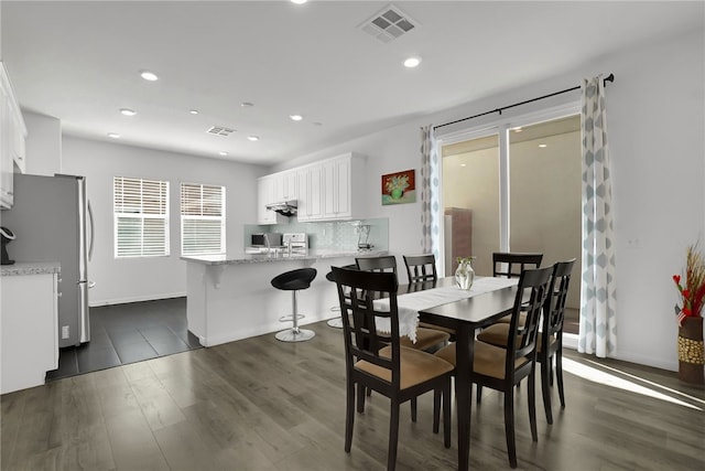 8595 Founders Grove St, Chino, CA 91708 - dining room with dark wood-type flooring and recessed lighting