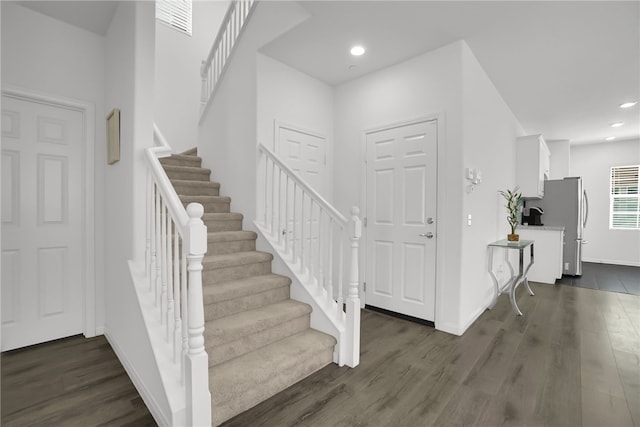 8595 Founders Grove St, Chino, CA 91708 - entryway featuring stairs, dark wood-style floors, and recessed lighting