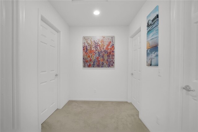 8595 Founders Grove St, Chino, CA 91708 - hallway featuring light colored carpet and baseboards