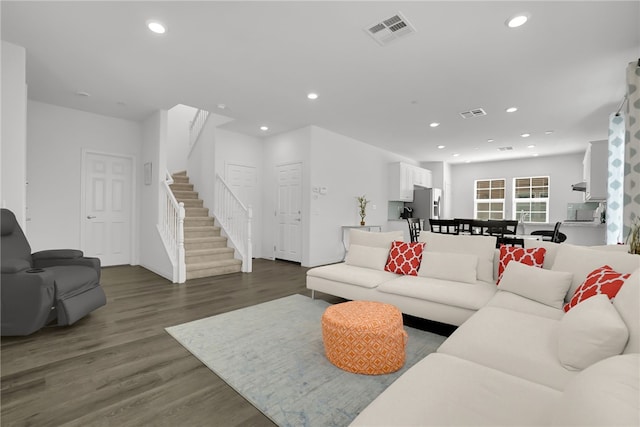 8595 Founders Grove St, Chino, CA 91708 - living room with stairway, dark wood finished floors, and recessed lighting