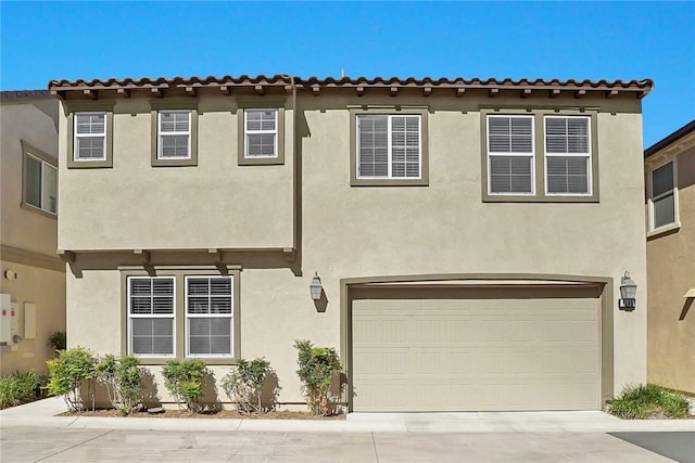 8595 Founders Grove St, Chino, CA 91708 - view of front of property featuring a garage, stucco siding, and concrete driveway