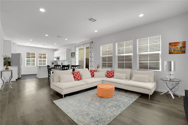 8595 Founders Grove St, Chino, CA 91708 - living area featuring dark wood-style flooring and recessed lighting