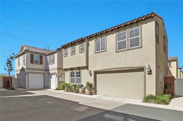 8595 Founders Grove St, Chino, CA 91708 - view of front of home featuring a garage and stucco siding