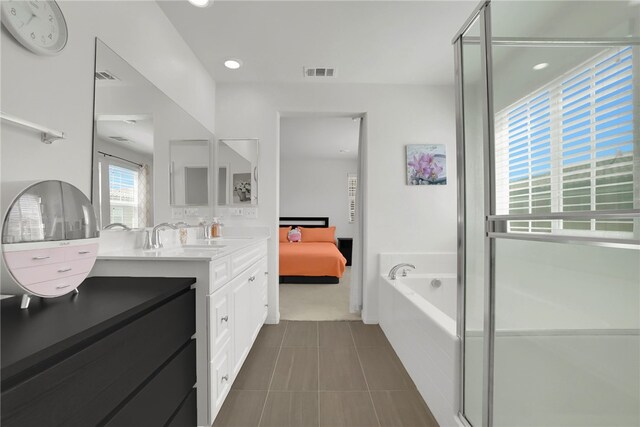 8595 Founders Grove St, Chino, CA 91708 - ensuite bathroom featuring vanity, a garden tub, tile patterned flooring, and recessed lighting