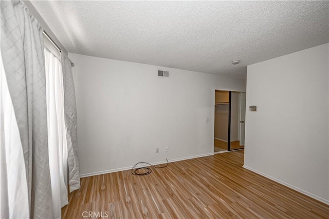 2917 Fairfield Ave, Palmdale, CA 93550 - empty room featuring a textured ceiling and wood finished floors
