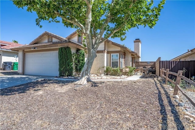 2917 Fairfield Ave, Palmdale, CA 93550 - view of front of house with stucco siding, a garage, a chimney, and driveway