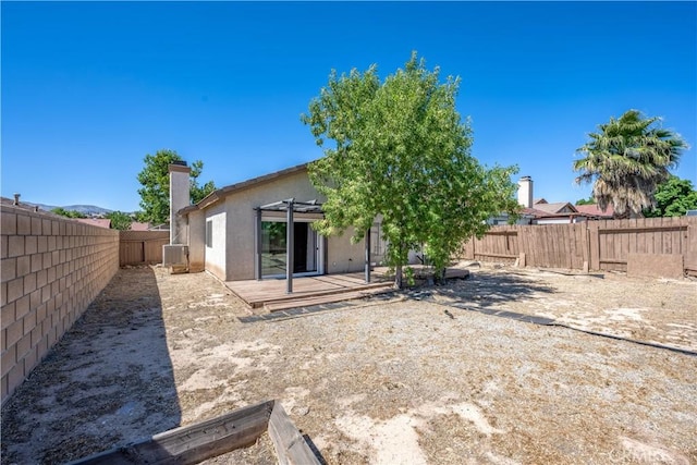 2917 Fairfield Ave, Palmdale, CA 93550 - rear view of property with a pergola, a fenced backyard, a chimney, stucco siding, and a patio