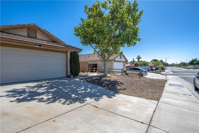 2917 Fairfield Ave, Palmdale, CA 93550 - single story home with concrete driveway, a garage, and stucco siding