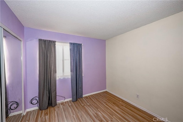 2917 Fairfield Ave, Palmdale, CA 93550 - empty room featuring wood finished floors and a textured ceiling