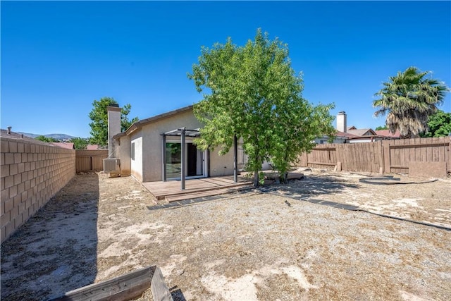 2917 Fairfield Ave, Palmdale, CA 93550 - back of house with a fenced backyard, a pergola, stucco siding, a chimney, and a patio
