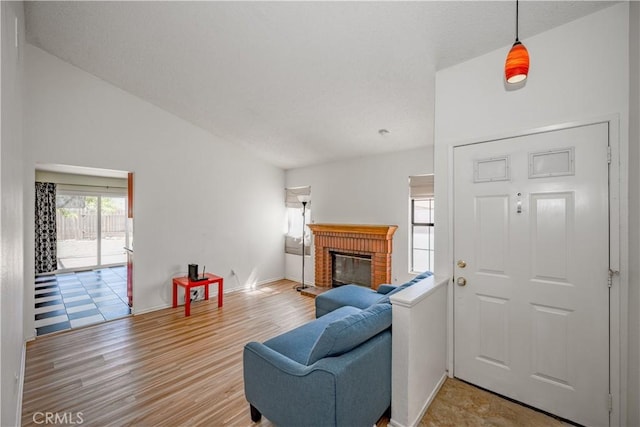 2917 Fairfield Ave, Palmdale, CA 93550 - living room featuring a brick fireplace and light wood-style floors