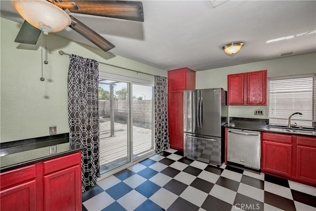 2917 Fairfield Ave, Palmdale, CA 93550 - kitchen featuring stainless steel appliances, dark brown cabinets, dark floors, and dark countertops