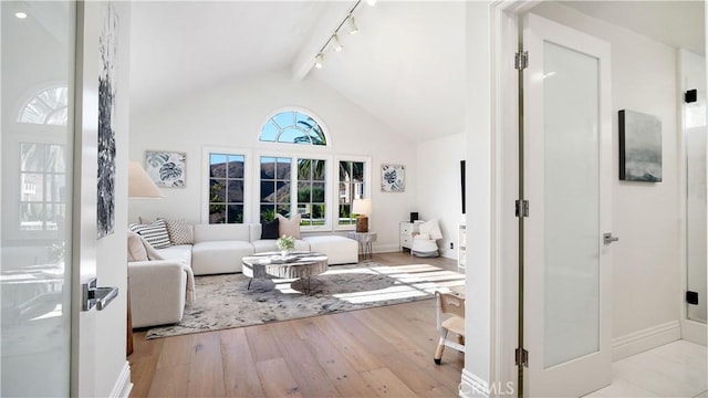 4855 Green Crest Dr, Yorba Linda, CA 92887 - living room featuring wood finished floors, beamed ceiling, track lighting, and high vaulted ceiling