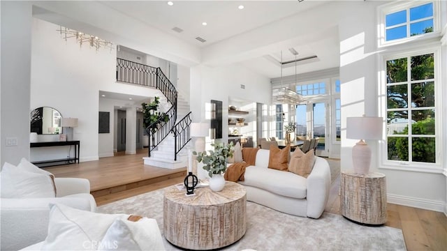 4855 Green Crest Dr, Yorba Linda, CA 92887 - living area with a high ceiling, wood finished floors, stairs, plenty of natural light, and recessed lighting