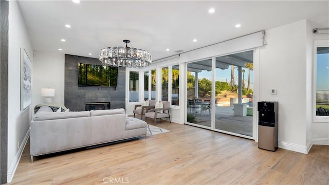 4855 Green Crest Dr, Yorba Linda, CA 92887 - living area with wood finished floors, recessed lighting, a fireplace, and a chandelier