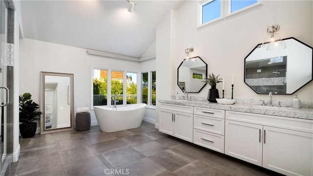 4855 Green Crest Dr, Yorba Linda, CA 92887 - full bathroom featuring double vanity, healthy amount of natural light, a soaking tub, tiled shower, and high vaulted ceiling