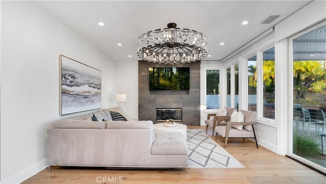 4855 Green Crest Dr, Yorba Linda, CA 92887 - living area featuring wood finished floors, recessed lighting, a fireplace, and a chandelier
