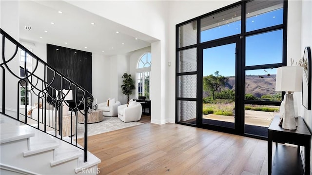 4855 Green Crest Dr, Yorba Linda, CA 92887 - entrance foyer featuring hardwood / wood-style floors, a high ceiling, stairway, and recessed lighting