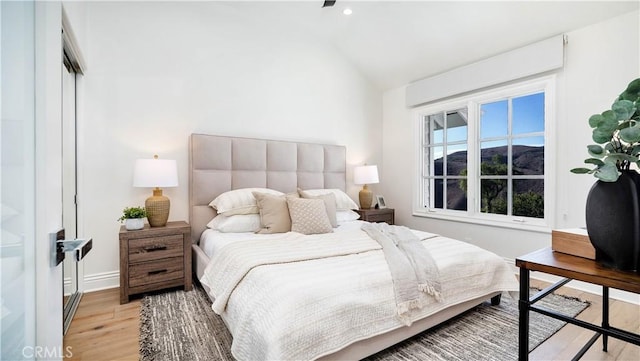 4855 Green Crest Dr, Yorba Linda, CA 92887 - bedroom with vaulted ceiling, light wood-style flooring, and a mountain view