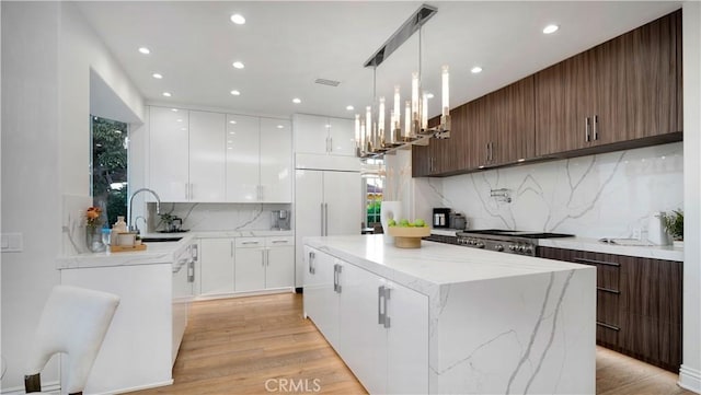 4855 Green Crest Dr, Yorba Linda, CA 92887 - kitchen with a center island, modern cabinets, recessed lighting, plenty of natural light, and decorative backsplash