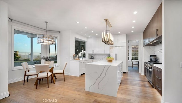 4855 Green Crest Dr, Yorba Linda, CA 92887 - kitchen with premium appliances, a chandelier, a kitchen island, light wood finished floors, and recessed lighting
