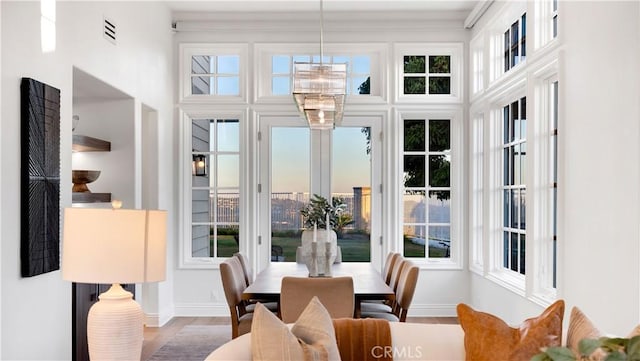 4855 Green Crest Dr, Yorba Linda, CA 92887 - dining area with plenty of natural light, wood finished floors, and a towering ceiling