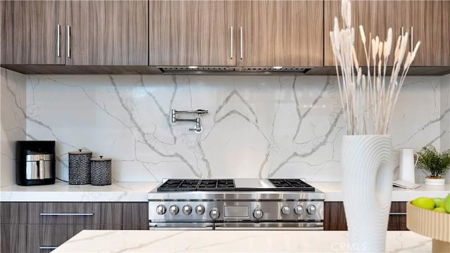 4855 Green Crest Dr, Yorba Linda, CA 92887 - kitchen featuring high end range, modern cabinets, range hood, and tasteful backsplash